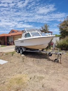 16 ft penguin half cabin boat, handles rough weather and flys in calm