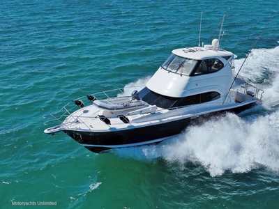 RIVIERA 47 ENCLOSED FLYBRIDGE HIGHLY OPTIONED WITH HYDRAULIC PLATFORM