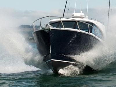 Inboard express cruiser - CUSTOM 950 - Dickey Boats Limited - with enclosed flybridge / hard-top / sport-fishing