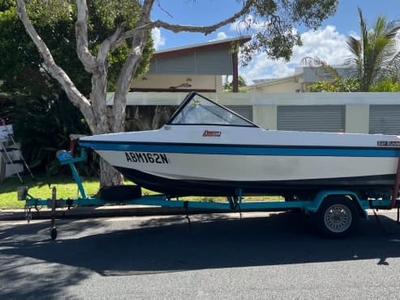 Fishing and recreational motor boat with trailer