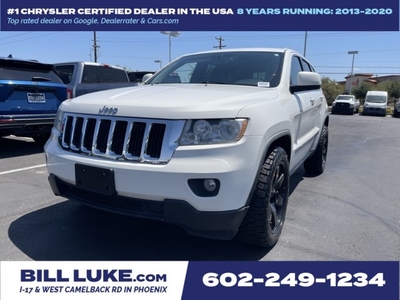 PRE-OWNED 2012 JEEP GRAND CHEROKEE LAREDO WITH NAVIGATION & 4WD
