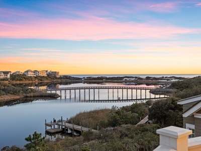 Lakefront Luxury Meets Coastal Charm In Coveted Beachside Community